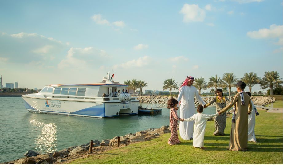 A happy family plays together while holding hands in the Arab region