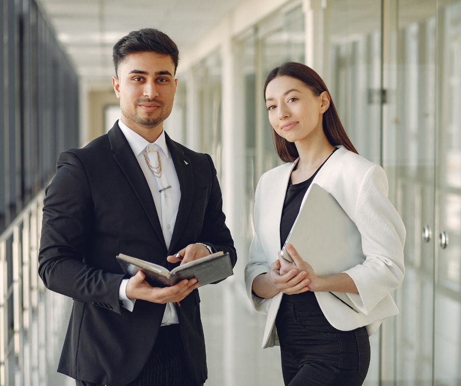 A man and a woman are in the office 