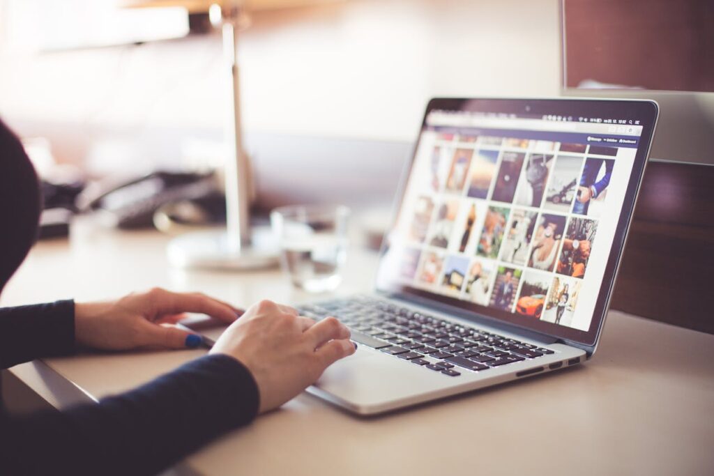 An image of a girl using social media on her laptop, potentially wasting time and risking mental health issues as a consequence.