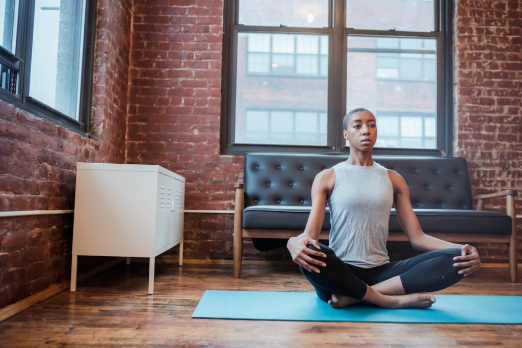 An image of a girl practicing yoga, seeking mental peace and tranquility.