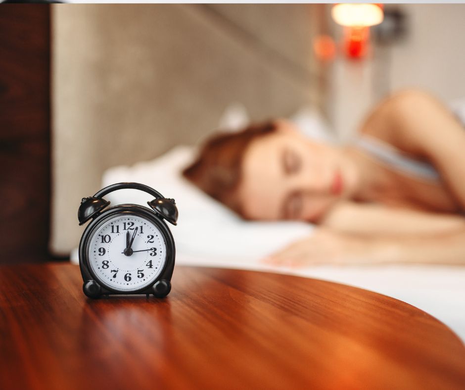 A woman finds ways to sleep better by being in bed by midnight.